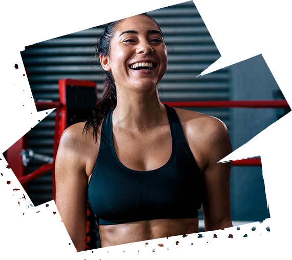 Fit woman wearing a dark colored sports bra having a laugh